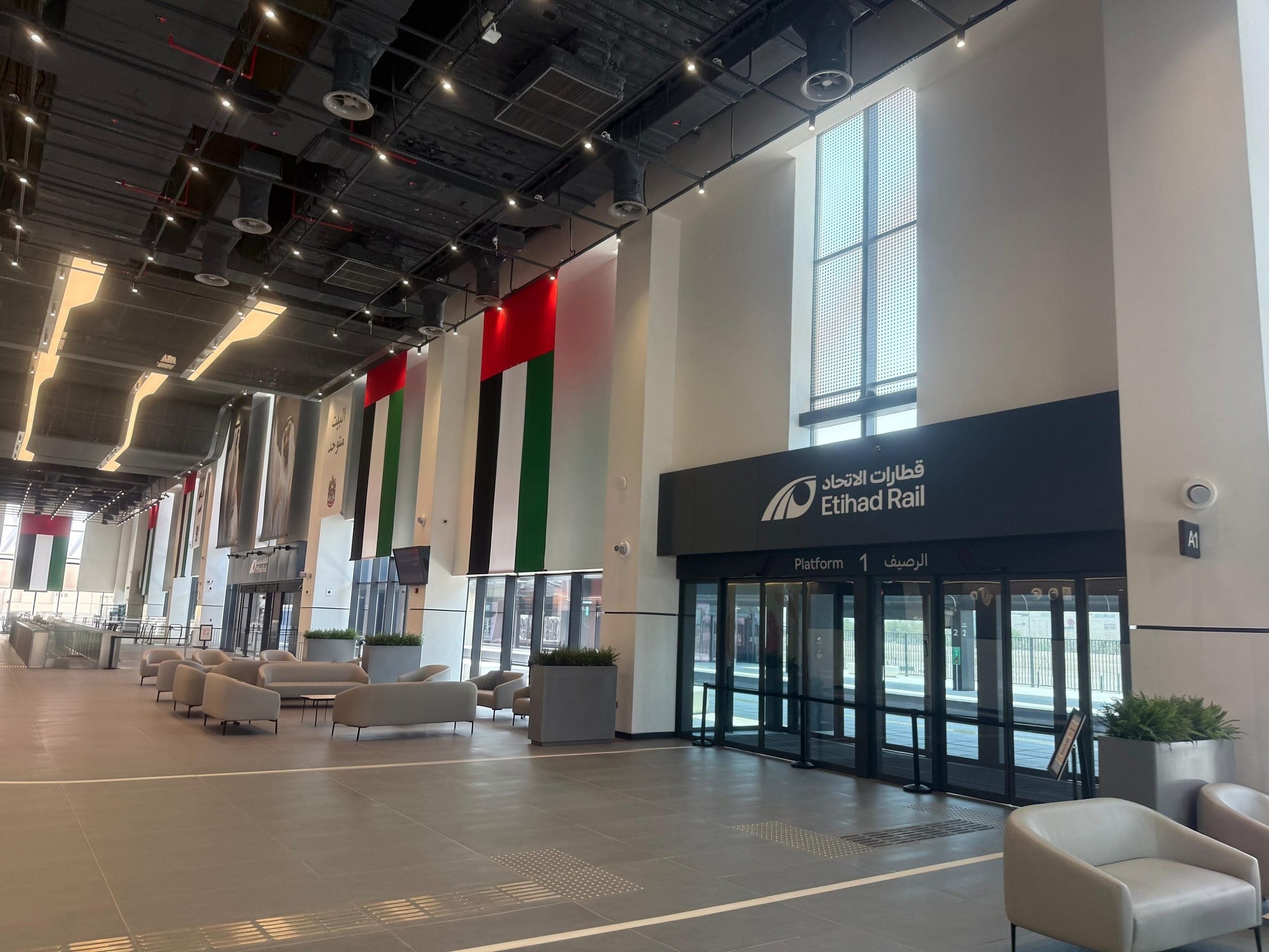 A completed Etihad Rail station concourse beside the entrance to Platform 1