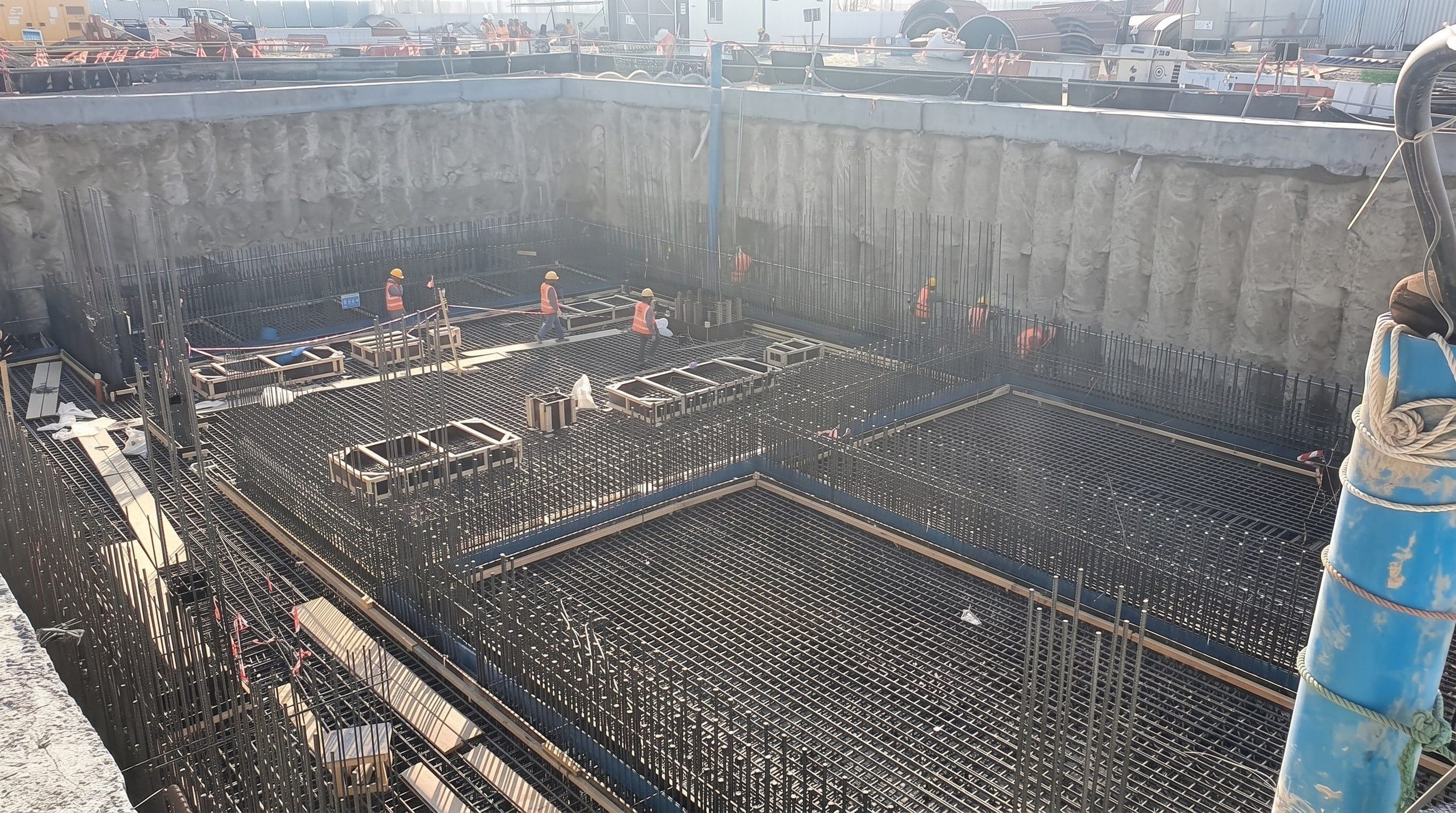 Steel reinforcement fixed in an excavation ahead of a concrete pour for a station structure